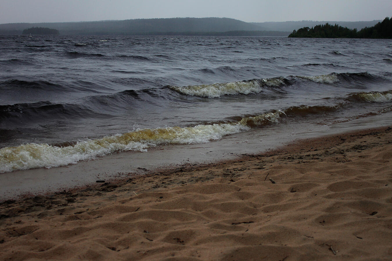 Photograph of a nearing storm on a beach.